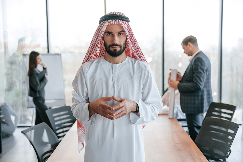people-behind-muslim-businessman-that-is-in-tradit-2024-02-21-00-09-03-utc